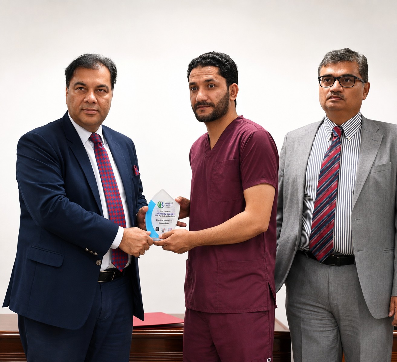Dr. Gul Muhammad receiving a recognition award