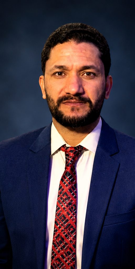 Portrait of Dr. Gul Muhammad in a navy suit